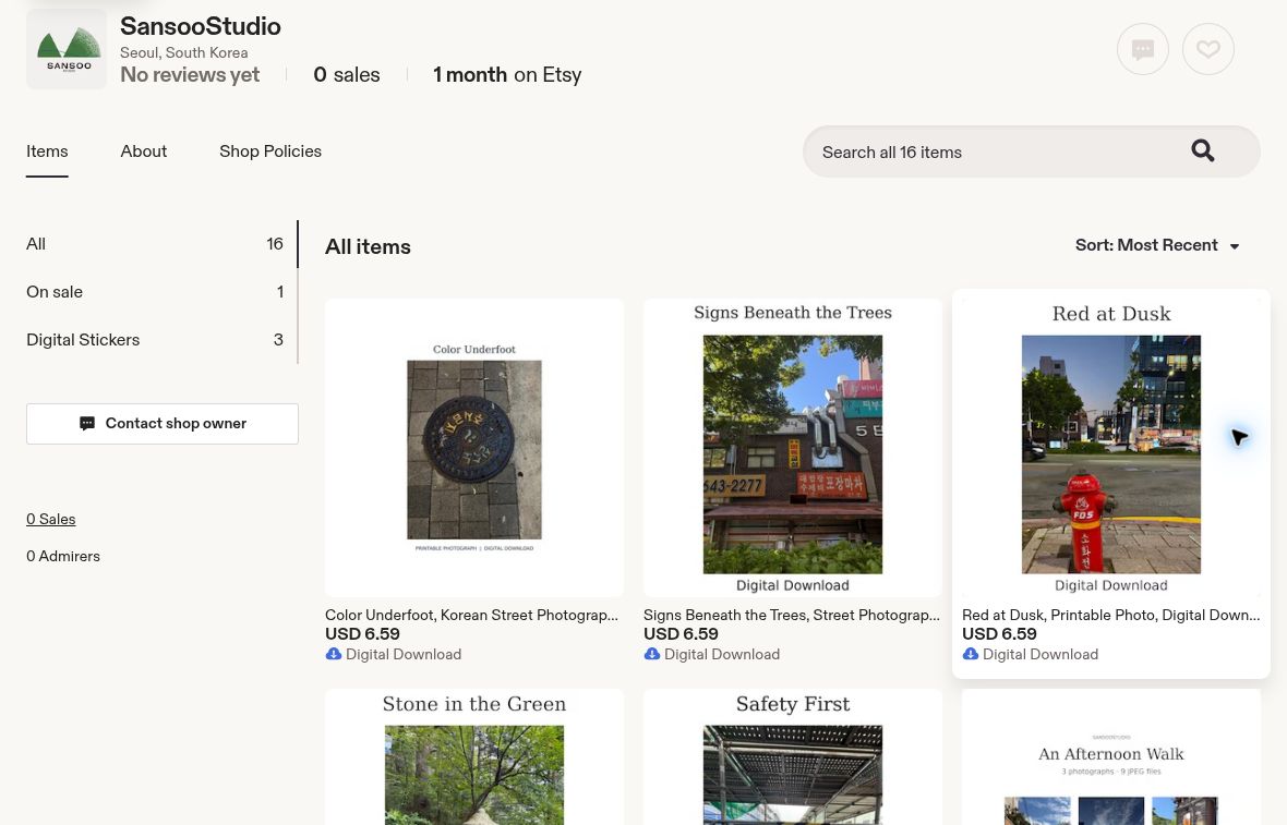SansooStudio Etsy shop displaying printable photographs of a manhole cover, Korean street signs, and a red fire hydrant.